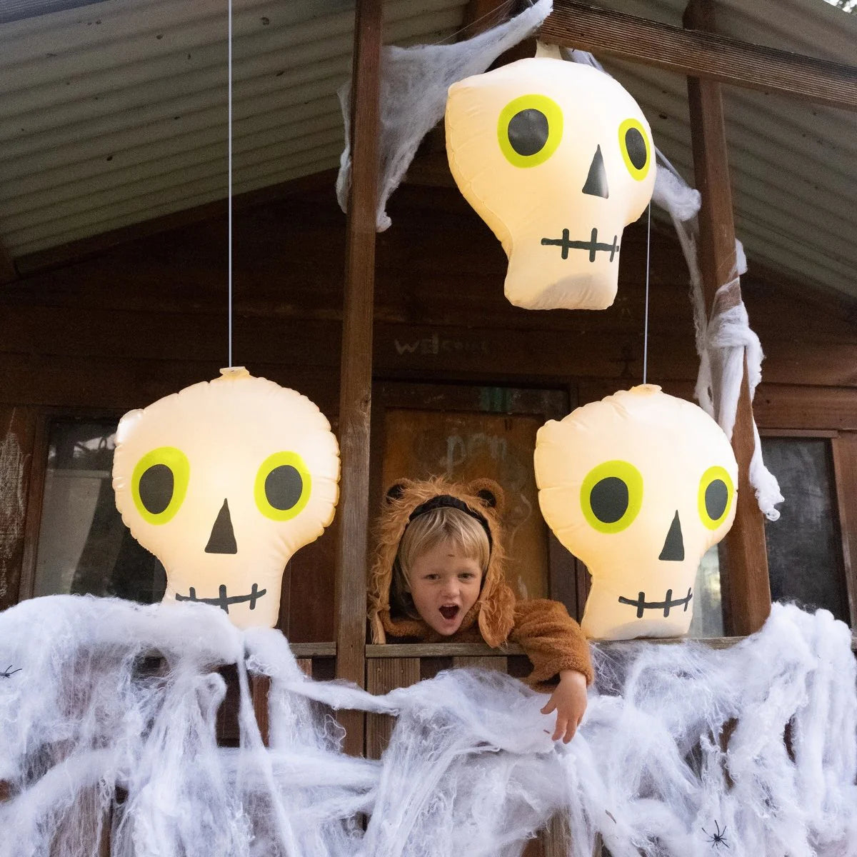 LIGHT UP HANGING SKULLS BONE